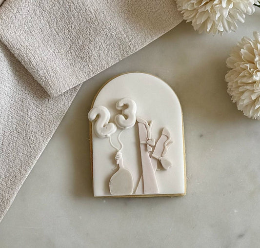 #12 - Woman holding balloons